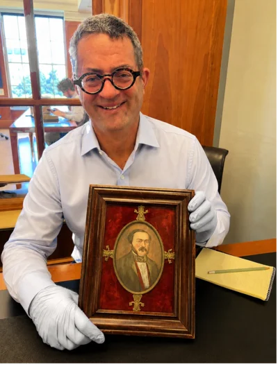 Eric Friedman with the portrait of William Alexander Leidesdorff